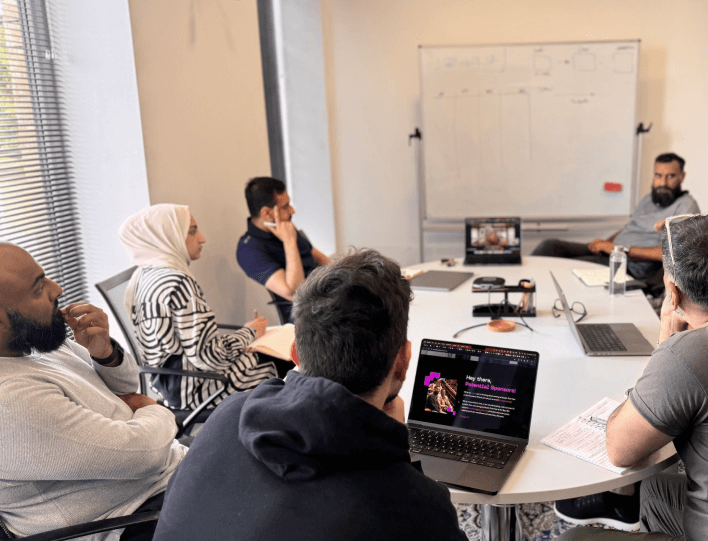 Image of Aqib in conversation at a networking event